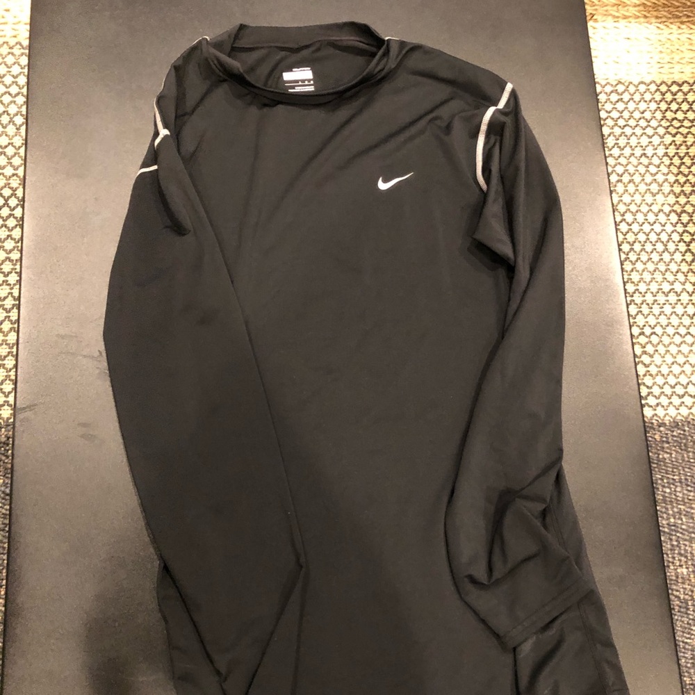 A pair of two Nike long sleeve athletic shirts
